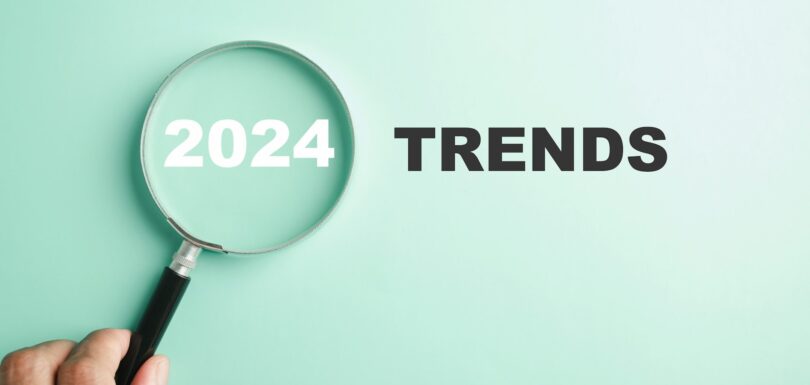 magnifier glasses reveal the words New Year 2024 Trends