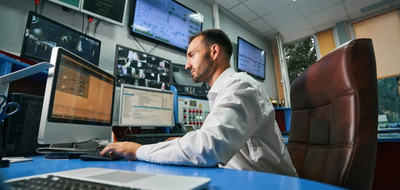 Man managing network of data center from computer